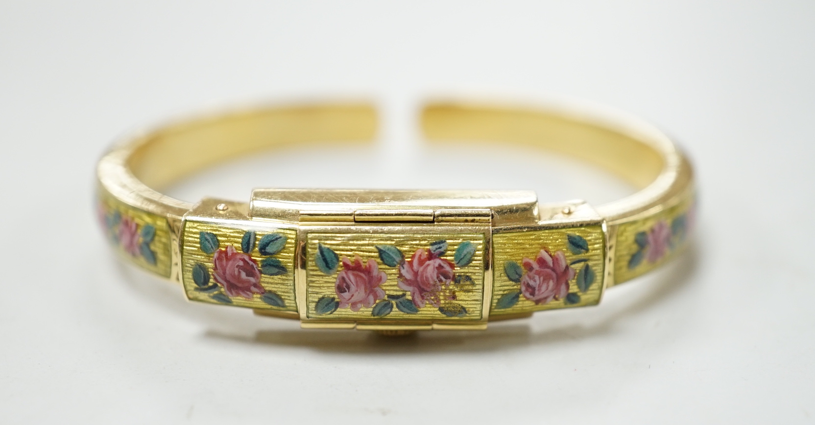 A lady's 750 and enamel Golay Stahl manual wind bangle watch, interior diameter 48mm, gross weight 22.6 grams.